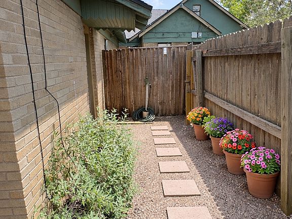 Walkway between front entrance and large patio area