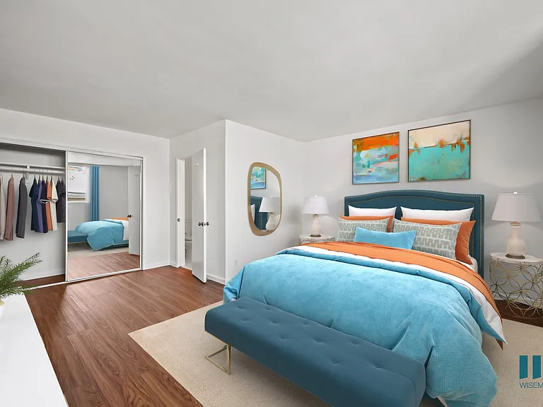Bedroom with Mirrored Closet and Vinyl Flooring