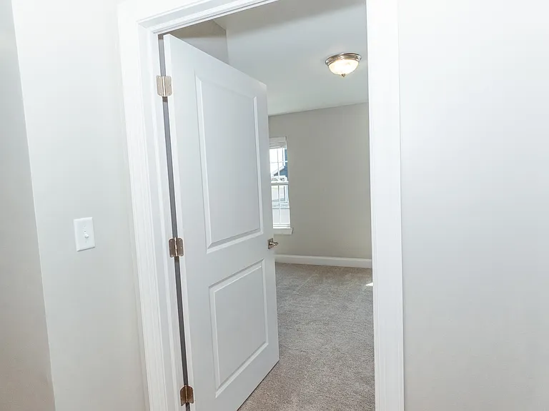 Entrance to your bedroom, located just to the right of the bathroom.