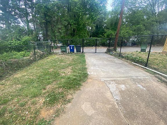 back yard with closed in fence, private parking
