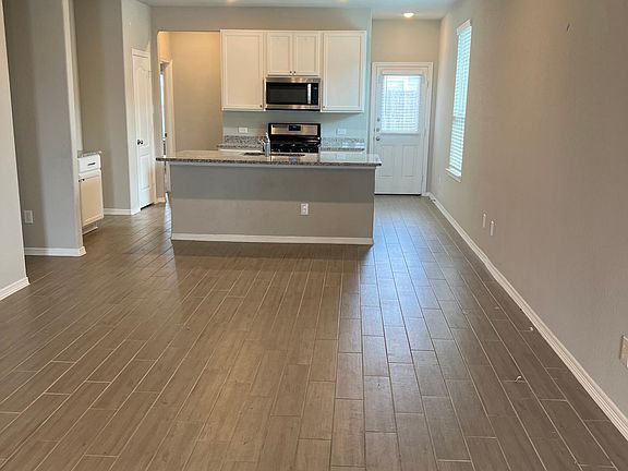 View from front door. Open concept living and kitchen.