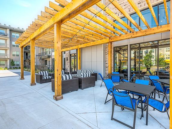 view of terrace with an outdoor hangout area and a pergola