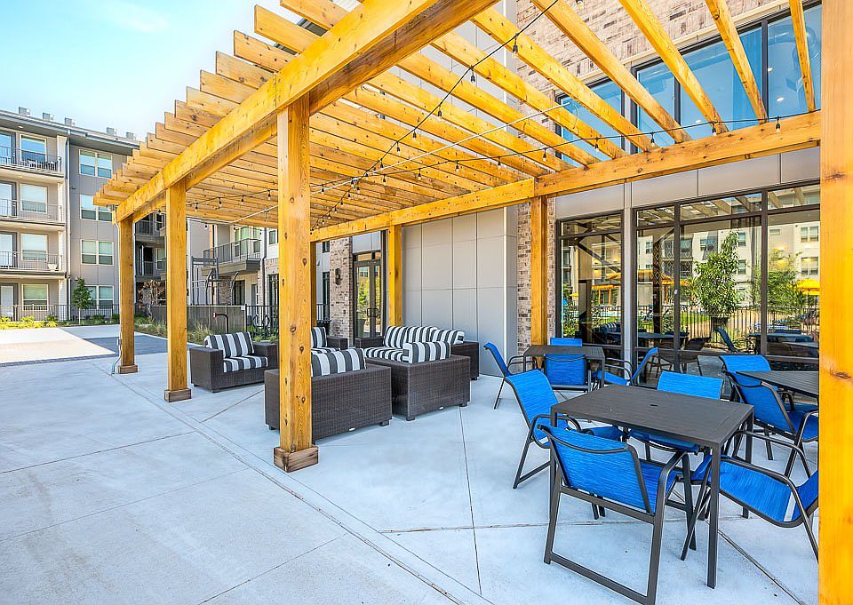 view of terrace with an outdoor hangout area and a pergola