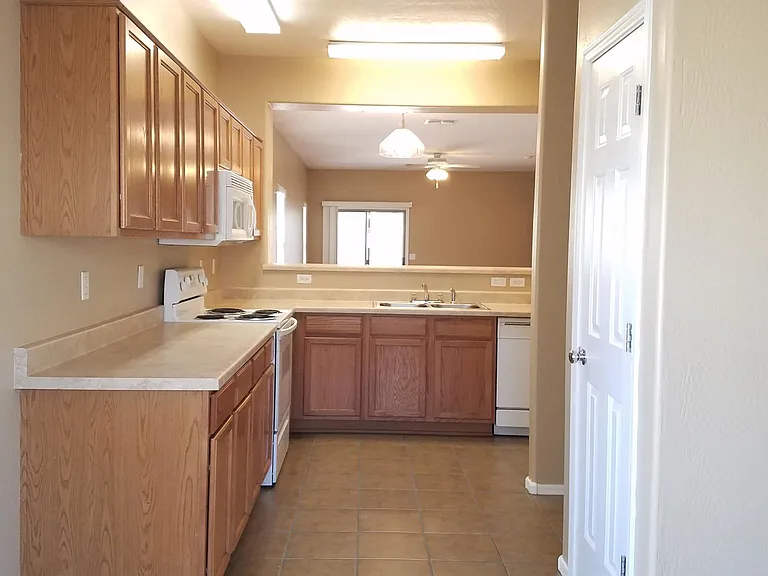 Kitchen looking into formal dining and living room.