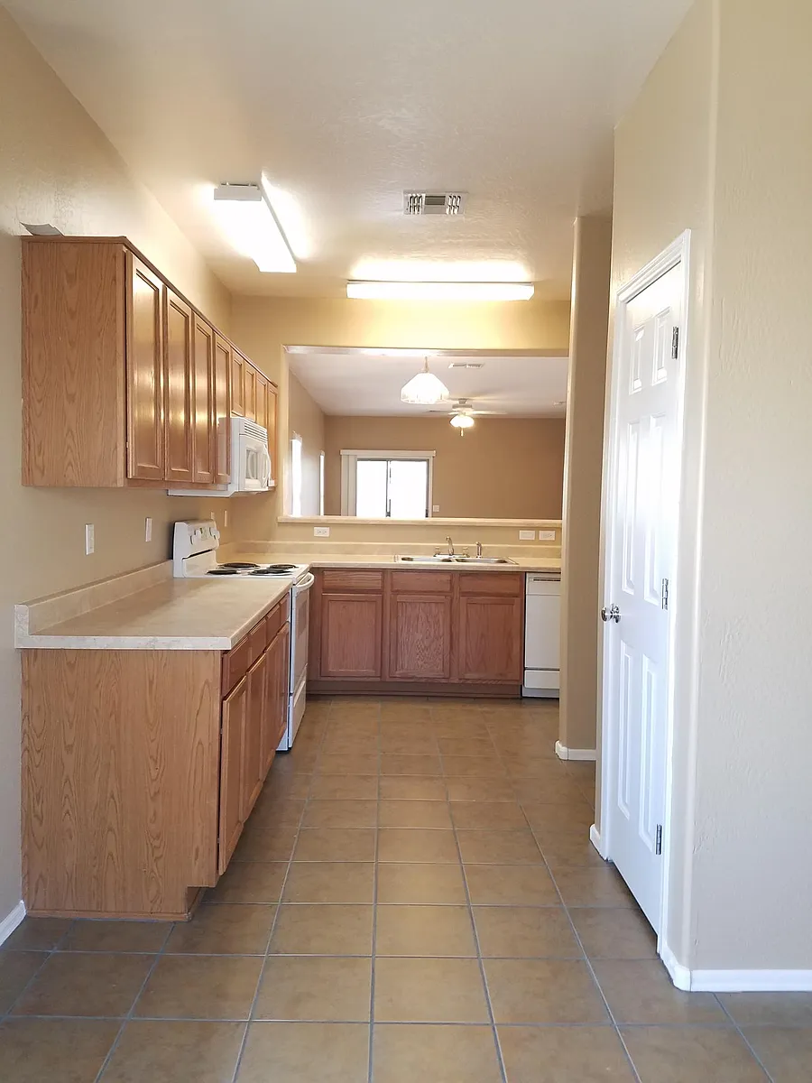 Kitchen looking into formal dining and living room. - 15140 N 172nd Ln