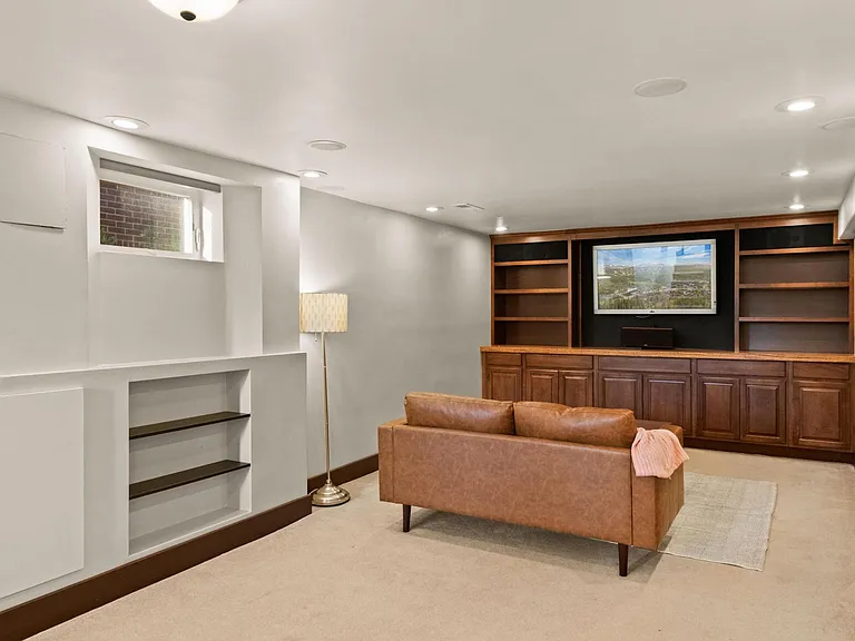Basement level large living space, TV included
