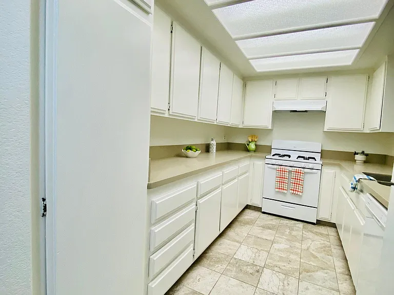 Lot of cabinets in kitchen.