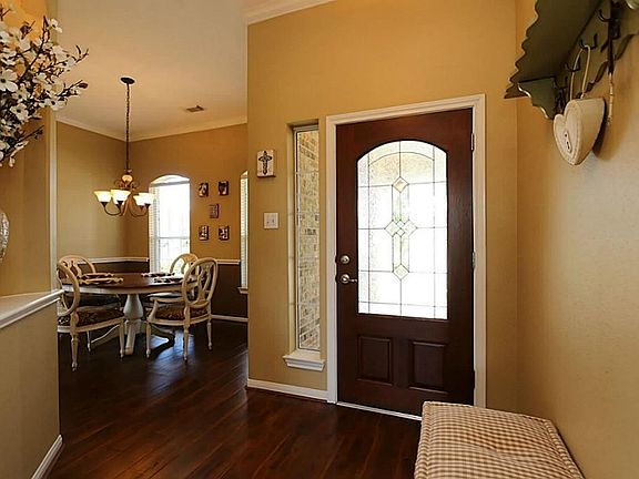 Step inside and immediately feel like you are home. A leaded glass door and a sidelight window allow