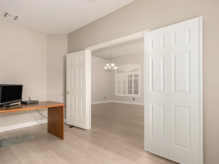 Private Office Adjacent to the Living Room with French Doors, Perfect for Meetings