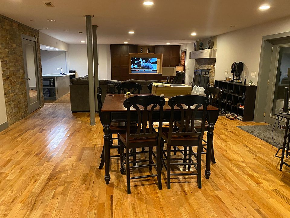 Hardwood floors throughout, stone accent walls