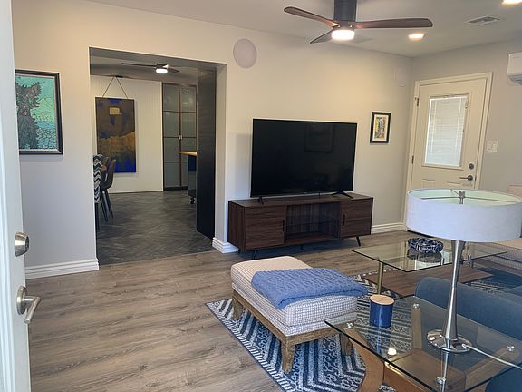 Entrance view, living room looking into the kitchen/dining area