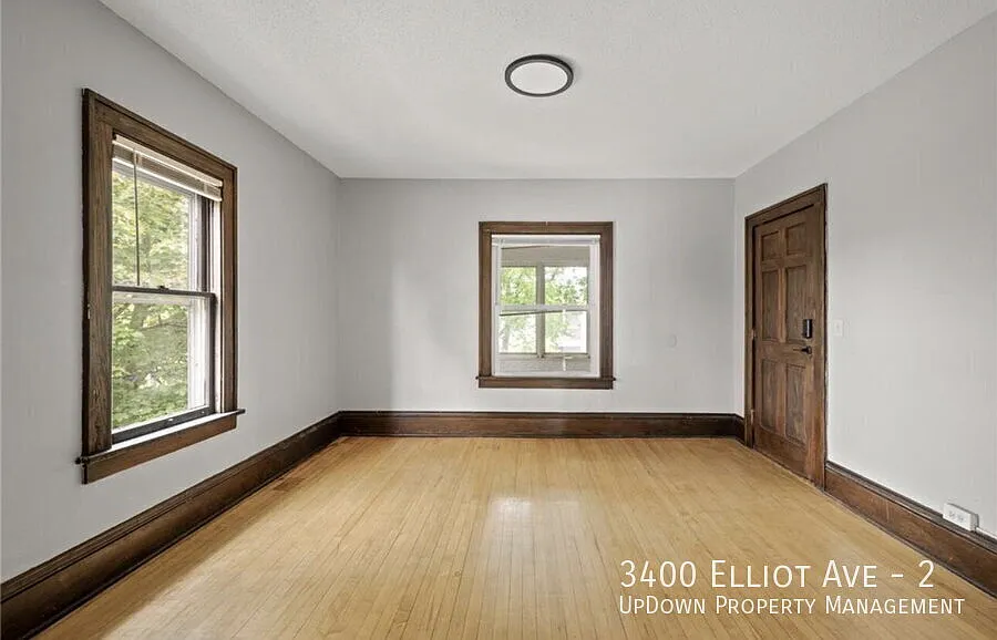 Charming 1-Bedroom Haven with Gleaming Hardwood Floors at 3400 Elliot Ave! — Photo 2