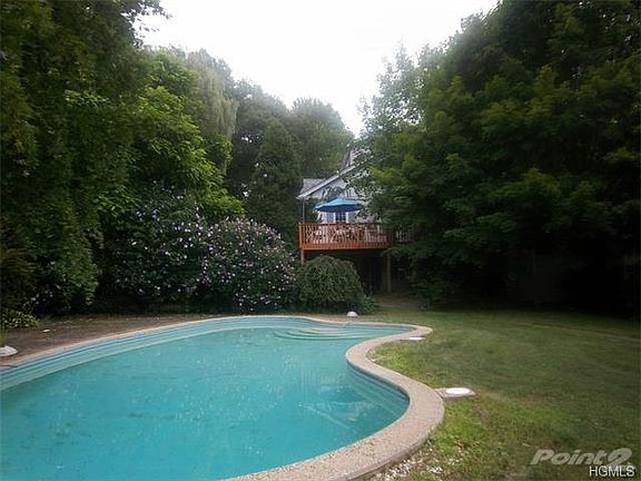 A raised deck overlooks the beautiful free form pool in the backyard...