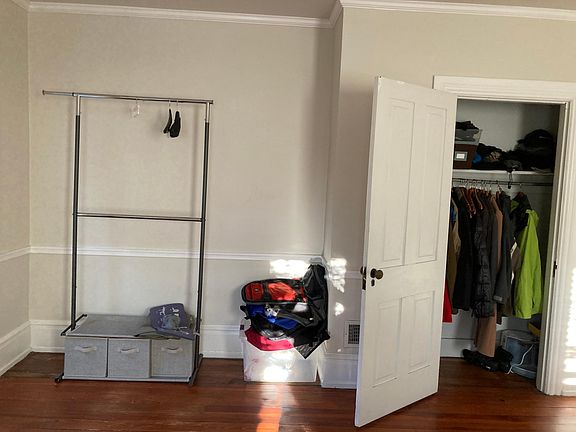 closet and extra hanging on rack supplied in large front bedroom