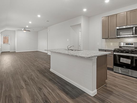 Kitchen to Dining Area and Family Room