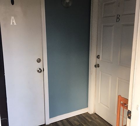 Main Entrance looking into doors to Apartment A (Upstairs Unit) and Apartment B (Downstairs Unit)