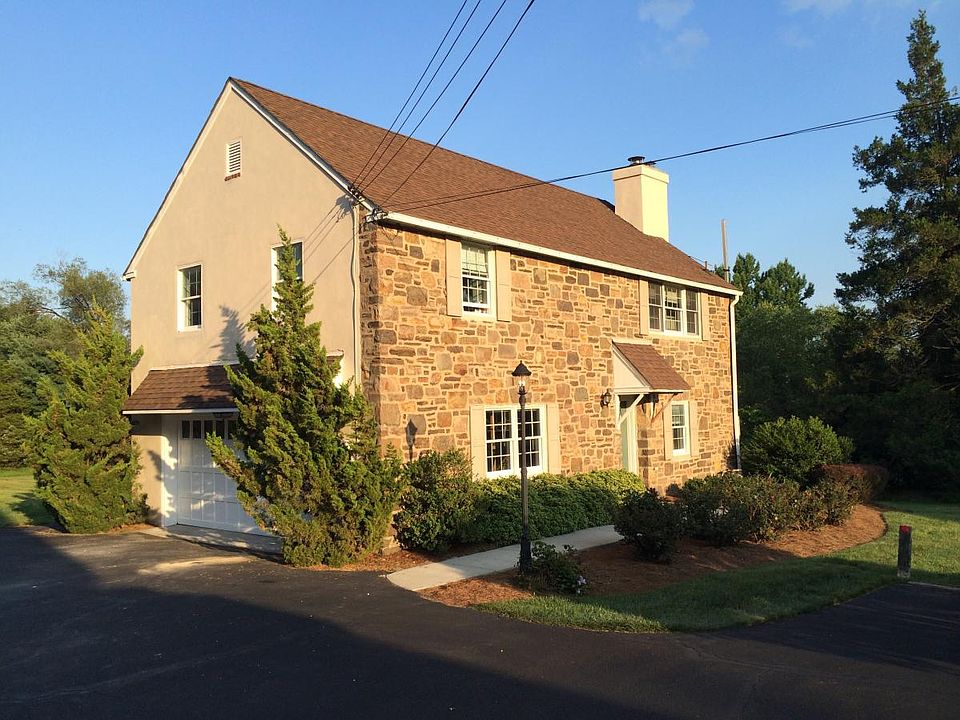 This is the home for rent, a two story home on the right-hand side of the driveway
