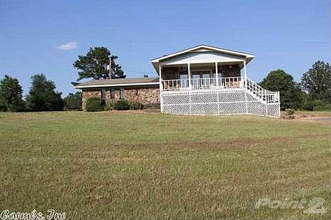 Vinyl & rock. 3 brs. 2 baths, +2 rooms downstairs.