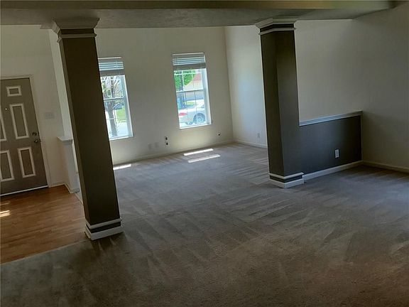Entry and great room with decorative columns