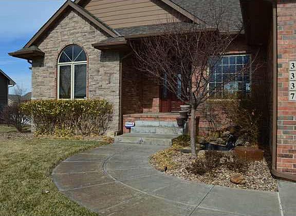 Gorgeous and inviting entry with koi pond.