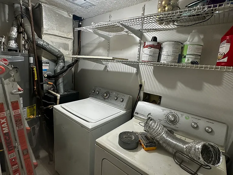 Utility room, furnace and water heater on the left of the picture - washer and dryer