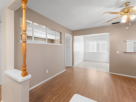 Bright entryway leading to a versatile dining area_ideal for office, lounge, or creative space.