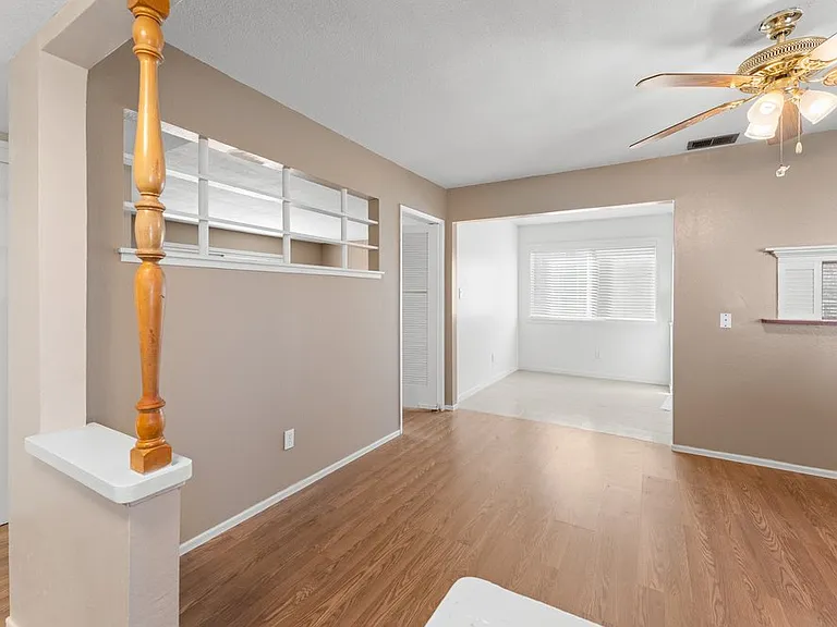 Bright entryway leading to a versatile dining area_ideal for office, lounge, or creative space.