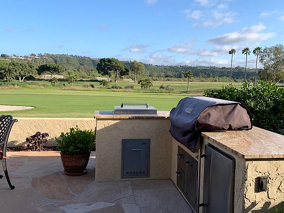 Custom built-in BBQ and burners with spacious refrigerator.