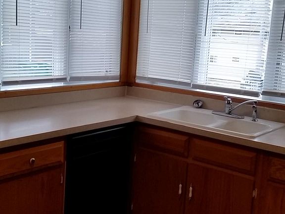Large Kitchen with plenty of cabinets, dishwasher, overlooking back yard.