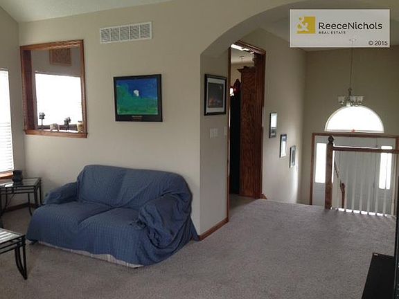 Open concept entry, living room and kitchen area