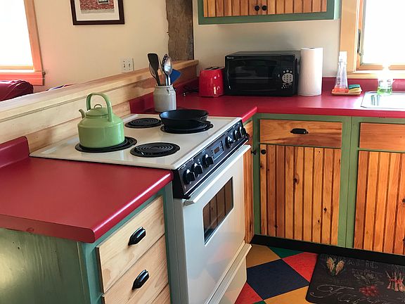 Kitchen with electric stove, fridge, dishwasher