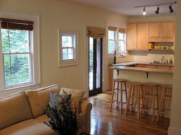 The living shares the breakfast bar with the open kitchen and would be great f