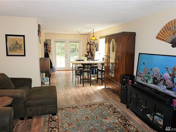 Picture from the family room looking at the dining area & French doors to back patio.