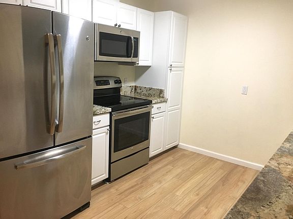 Kitchen with Full Fridge and Stainless appliances