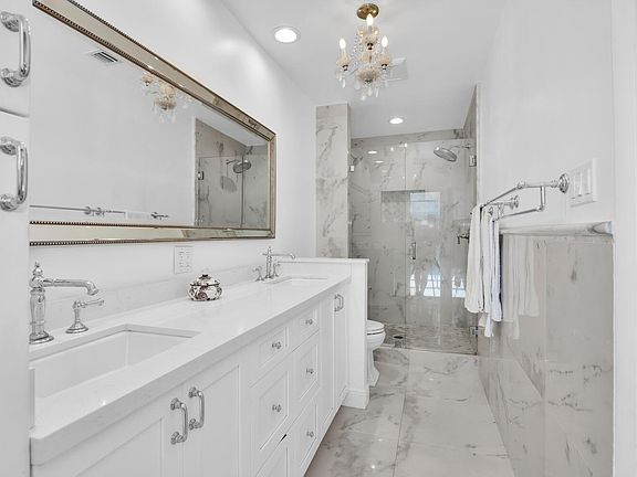 Primary Bathroom w/great storage cabinets & pool access