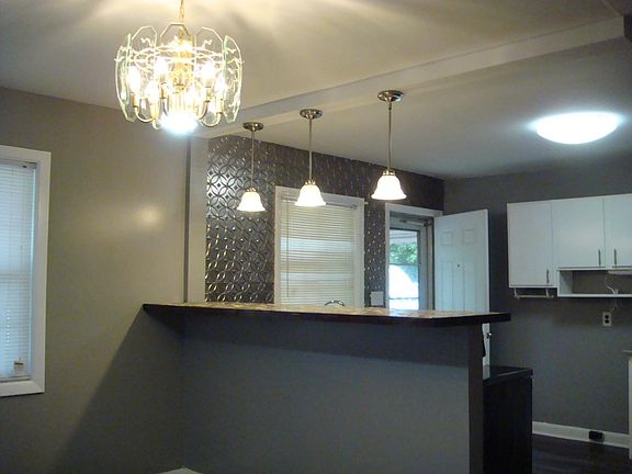This is the dining area and a bar capable of seating 4.
