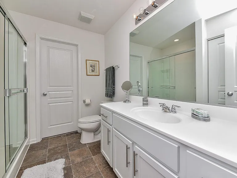Primary bathroom attached to main bedroom