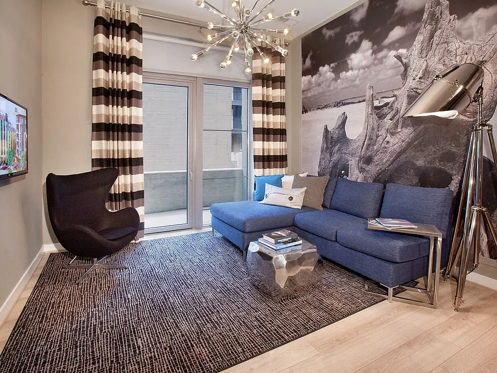 Living area with hard surface flooring and balcony - Avalon Potomac Yard
