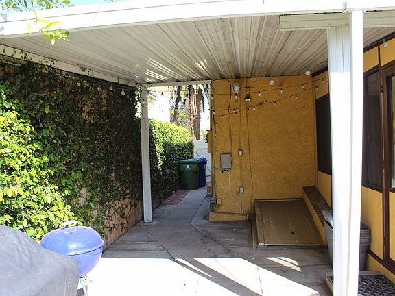 View of side gate from enclosed patio