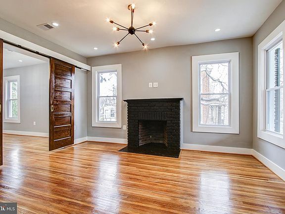 Living Room w/Charming Fireplace and Sliding Doors