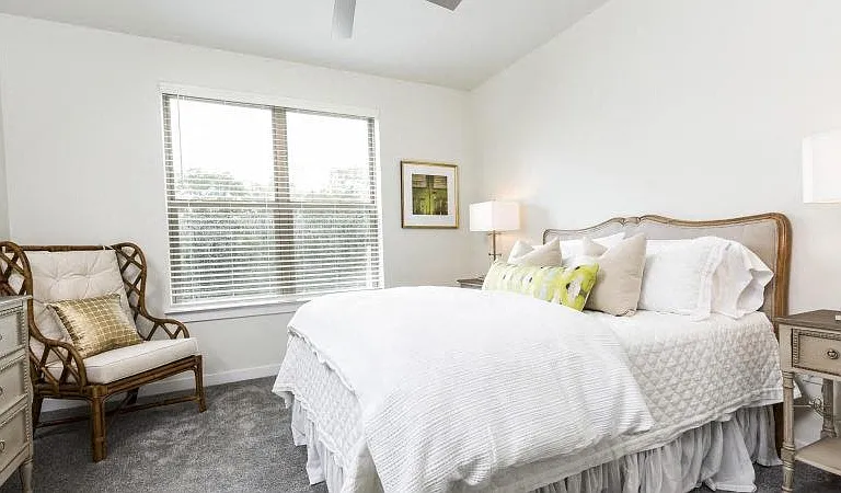 Master bedroom with ceiling fan, carpet flooring and window