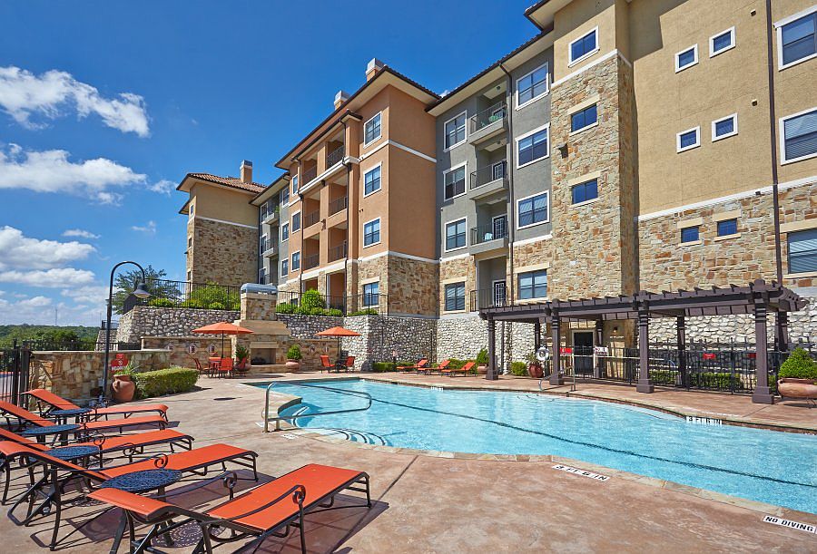 Three leisure swimming pools with lounge seating