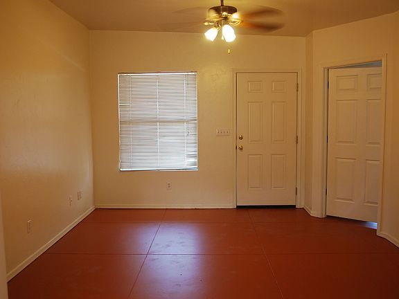 Living room, showing front door and bedroom 1