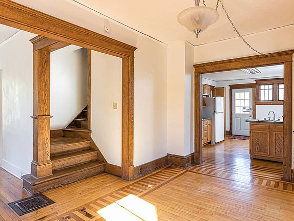 dining room with wood inlaid hardwood