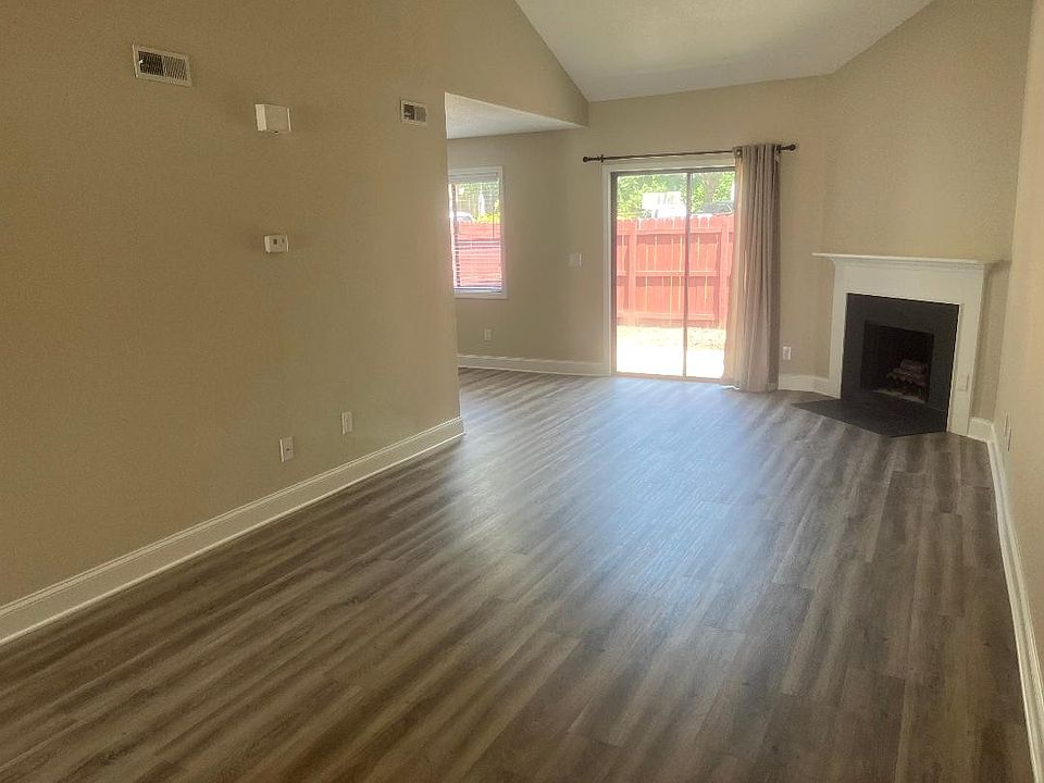 Living area opens to dining room and patio