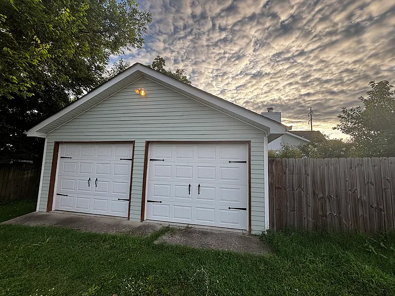Extended length two-car garage. One side plus storage will be available. Owner stores antique auto on other side.