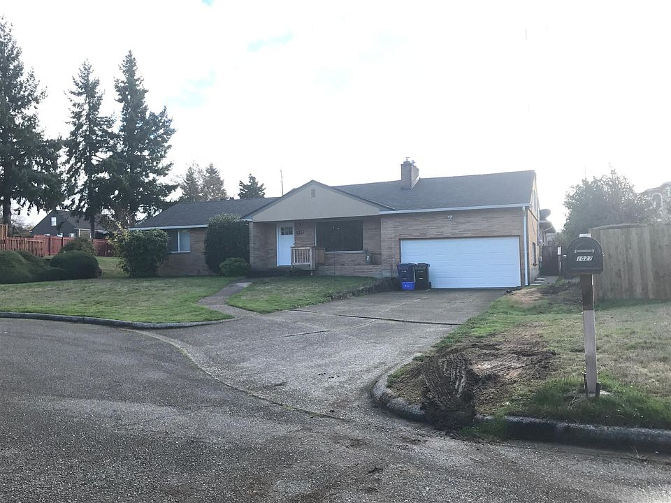 This a duplex style home: Unit B entrance is to the right of the home behind the garage.