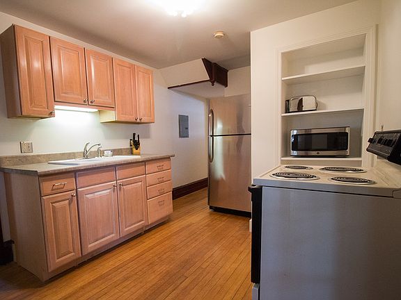 Kitchen equipped with most basic necessities and hardwood fl