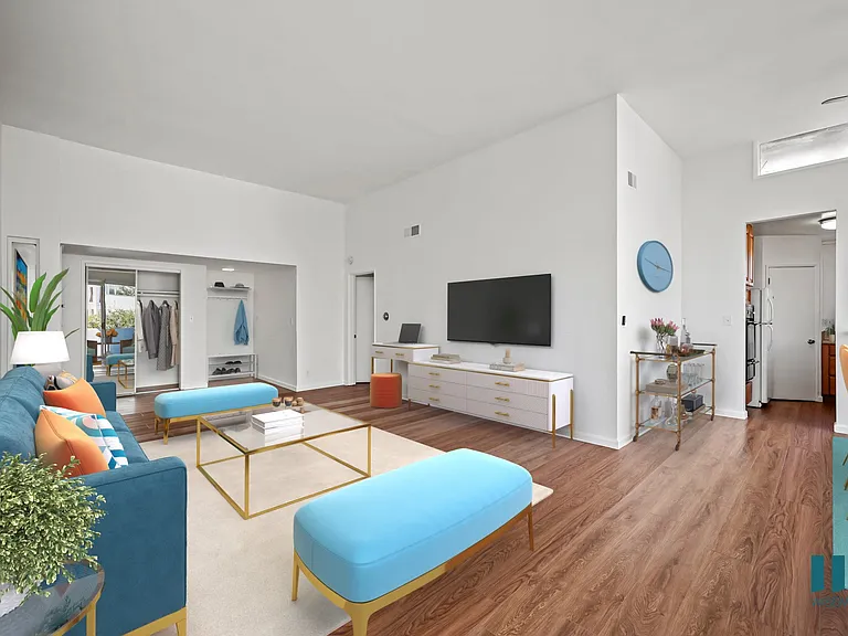 Open-Concept Living and Dining Room with a Hall Closet and Vinyl Flooring