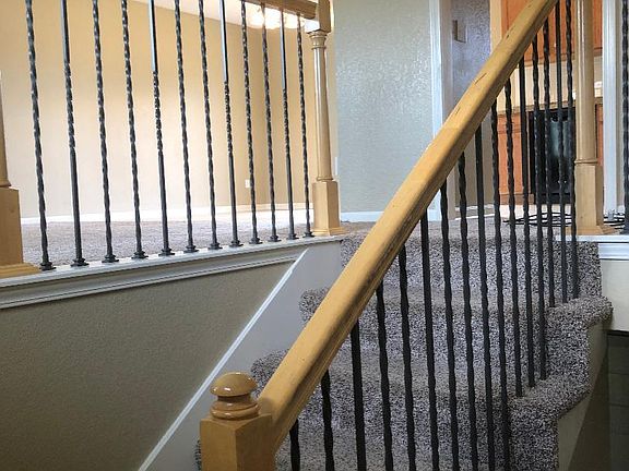 Split entry home with two living areas up and down. Living room down has 1/2 bath.